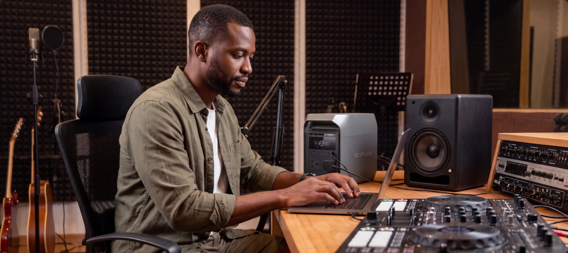 A person working with his laptop powered by DELTA 3 Classic