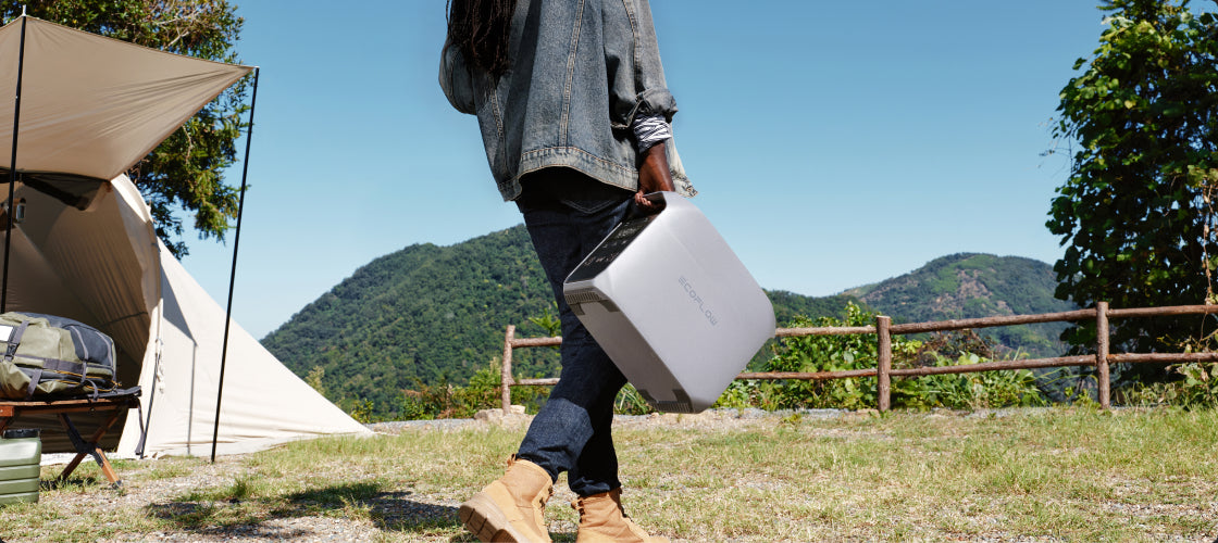 A person carrying DELTA 3 Classic for camping which shows its portability